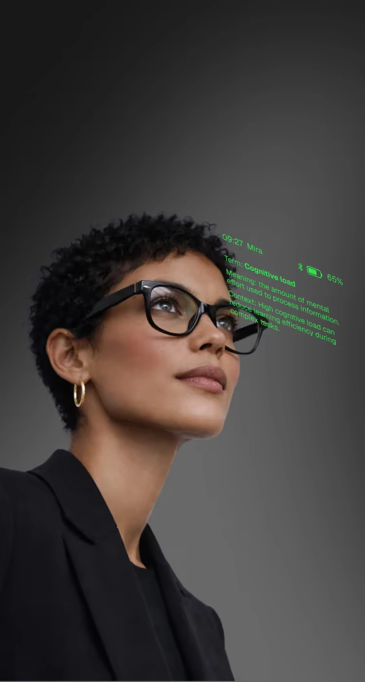 A woman in a dark blazer with a green readout beside her face