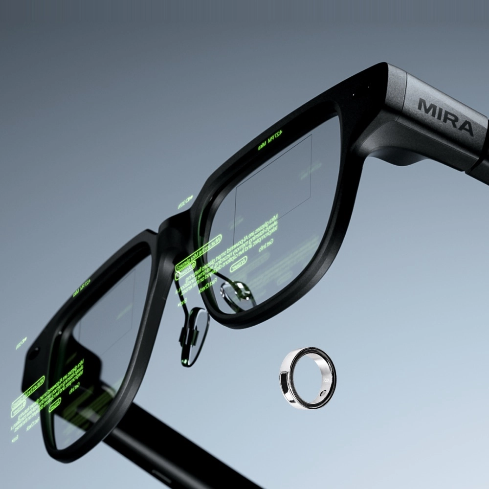 MIRA glasses with green text on the lens and a ring floating nearby